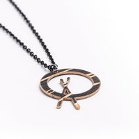 Load image into Gallery viewer, Dark Cross Stick - Reclaimed Cymbal Necklace